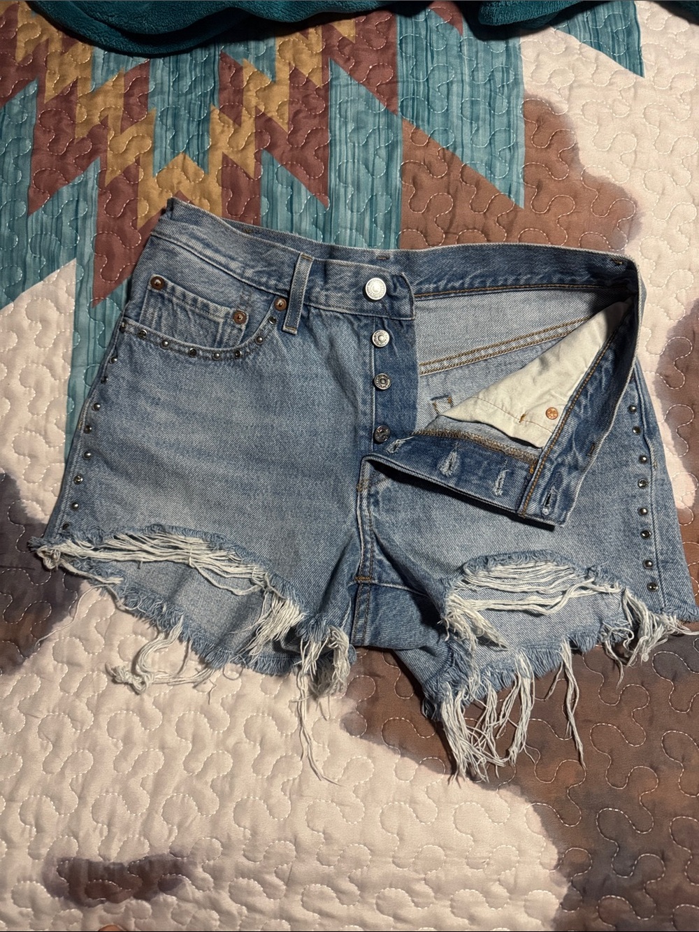 Levi's studded High-Rise Light Blue Distressed Jean Shorts with Button Fly